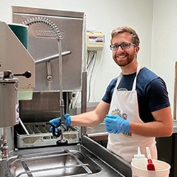 Samaritan Place - Tim Washing Dishes